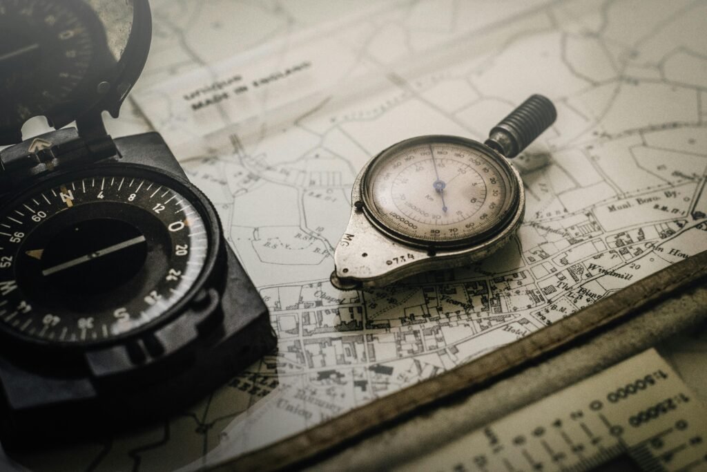 pexels-photo-1203808-1203808 A vintage compass and navigation instrument on an old map, showcasing precision tools for exploration.